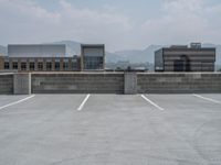 a parking lot and wall are pictured in a photo from the perspective point of view