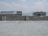 a parking lot and wall are pictured in a photo from the perspective point of view