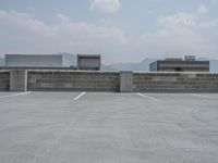 a parking lot and wall are pictured in a photo from the perspective point of view