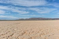 a man is riding his bike through the desert with no one on board or the motorbike