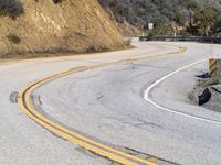 USA's Desert Landscape: A Mountain Pass with Asphalt Road