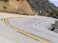 USA's Desert Landscape: A Mountain Pass with Asphalt Road