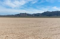 dry desert and mountain scenery under a clear sky on an island of land with arid land