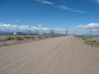 USA: A Dirt Road Leading to a Power Plant in Nature