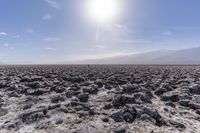 the vast expanse of this desert contains many rocks and boulders that are scattered about each other