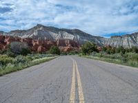 USA Landscape: An Asphalt Road Underneath Drifting Clouds