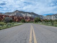 USA Landscape: An Asphalt Road Underneath Drifting Clouds