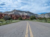 USA Landscape: An Asphalt Road Underneath Drifting Clouds