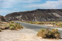 USA Landscape: A Dirt Road Through Mountains and Clouds