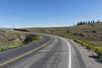 a curve sign is shown on the side of a road in the middle of nowhere