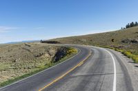 a curve sign is shown on the side of a road in the middle of nowhere