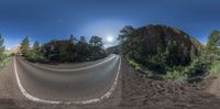 the panoramic view of a road is shown in a fish - eye lens