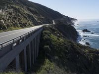 a scenic road near the ocean in the country side of california's pacific coast