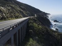 a scenic road near the ocean in the country side of california's pacific coast