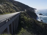 a scenic road near the ocean in the country side of california's pacific coast