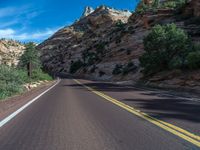 USA Landscape: Road Through Mountains and Clouds