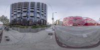 a 360 - degree view of a man riding a skateboard down a cement ramp