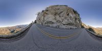 this is a 360 - panoramic photo of the road in the mountains that is part of the route