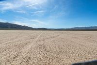 the desert is dirty and it looks as if it are going down a mountain