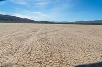 the desert is dirty and it looks as if it are going down a mountain