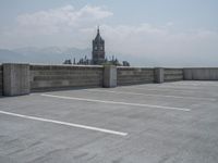 a parking lot and wall are pictured in a photo from the perspective point of view