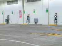 an empty parking garage with no one at the pumps with many electronic devices on the wall