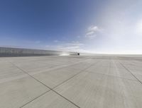 a plane is parked at the airport in the sunlight on a sunny day with a dustin of dust around the wing