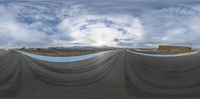 view from the skateboarder doing tricks in the air on the track under clouds