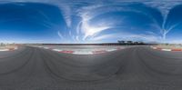 a 360 - lens image of a racing track in progress for the race and you can see it in the distance