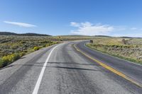 USA Road: Asphalt through a Scenic Mountain Landscape