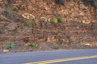 USA Road Through Asphalt Mountain Landscape