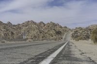 USA Road: Asphalt Lined with Mountains