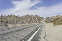 USA Road: Asphalt Lined with Mountains