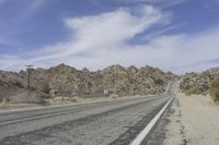 USA Road: Asphalt Lined with Mountains