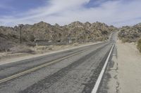 USA Road: Asphalt Lined with Mountains