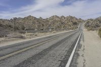 USA Road: Asphalt Lined with Mountains