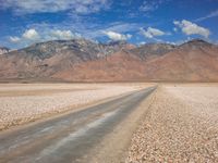 USA Road Through Brown Landscape and Clouds