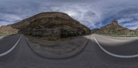 three point perspective images of a highway with a mountain in the background with some clouds above