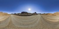 this is a 360 - vision photograph of a desert landscape in winter time taken using the fisheye lens