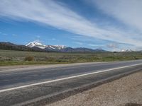 USA's Rural Landscape: Cloudy Mountains and a Serene Road