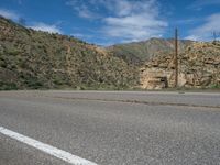 USA Scenic Drive: Mountain Road with Dramatic Clouds