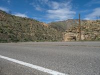 USA Scenic Drive: Mountain Road with Dramatic Clouds