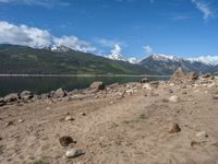 Scenic View in the USA: A Lake Surrounded by Mountains and Clouds