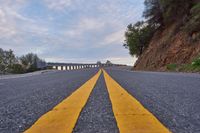 USA: Straight Down the Road with a Low Mountain View