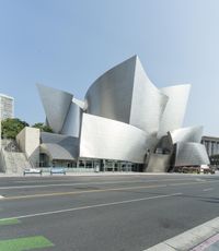 a photo of the large modern building near a city street of some sort as art