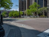 an intersection with buildings on both sides and a street light in the middle of the road