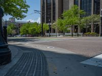 an intersection with buildings on both sides and a street light in the middle of the road