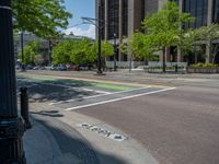 an intersection with buildings on both sides and a street light in the middle of the road