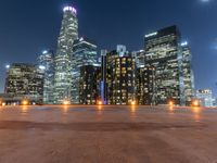 a view of the city from a low angle to the horizon at night time with many buildings