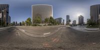 a city intersection is shown from the same perspective as a fish eye lens image of a street